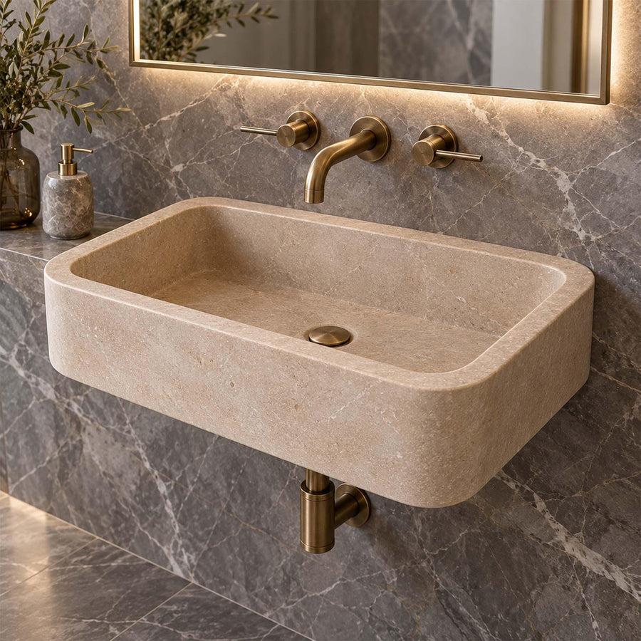Front view of a hand-carved Beige Travertine rounded floating sink