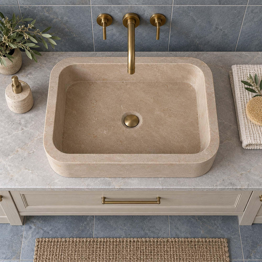Natural stone rounded floating sink in Beige Travertine with brass fittings