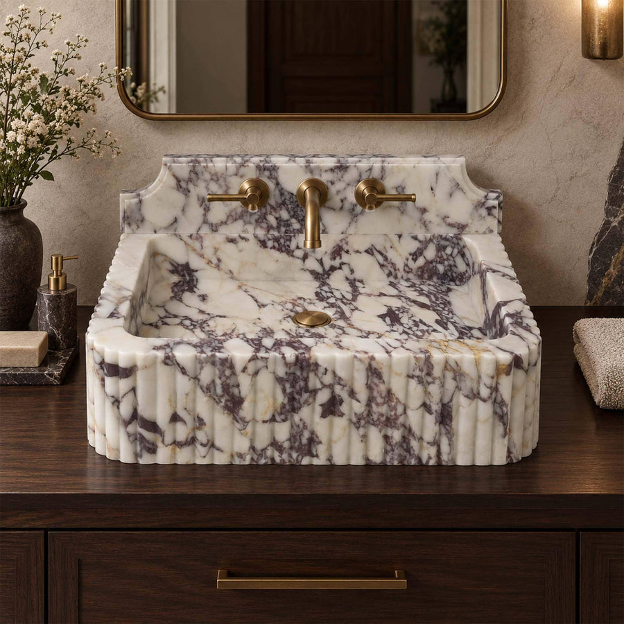 Calacatta Viola fluted marble sink with Firenze backsplash on a wood vanity cabinet