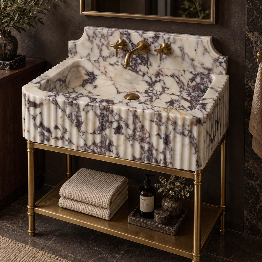 Calacatta Viola fluted marble sink with Firenze backsplash on a custom brass vanity stand