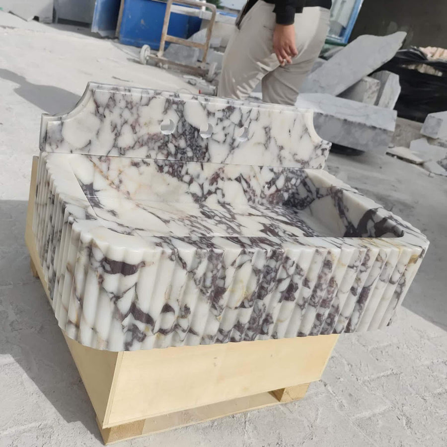 Calacatta Viola fluted marble sink with Firenze backsplash in a luxury bathroom
