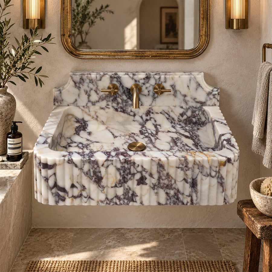 Calacatta Viola fluted marble sink with Firenze backsplash styled in a designer powder room