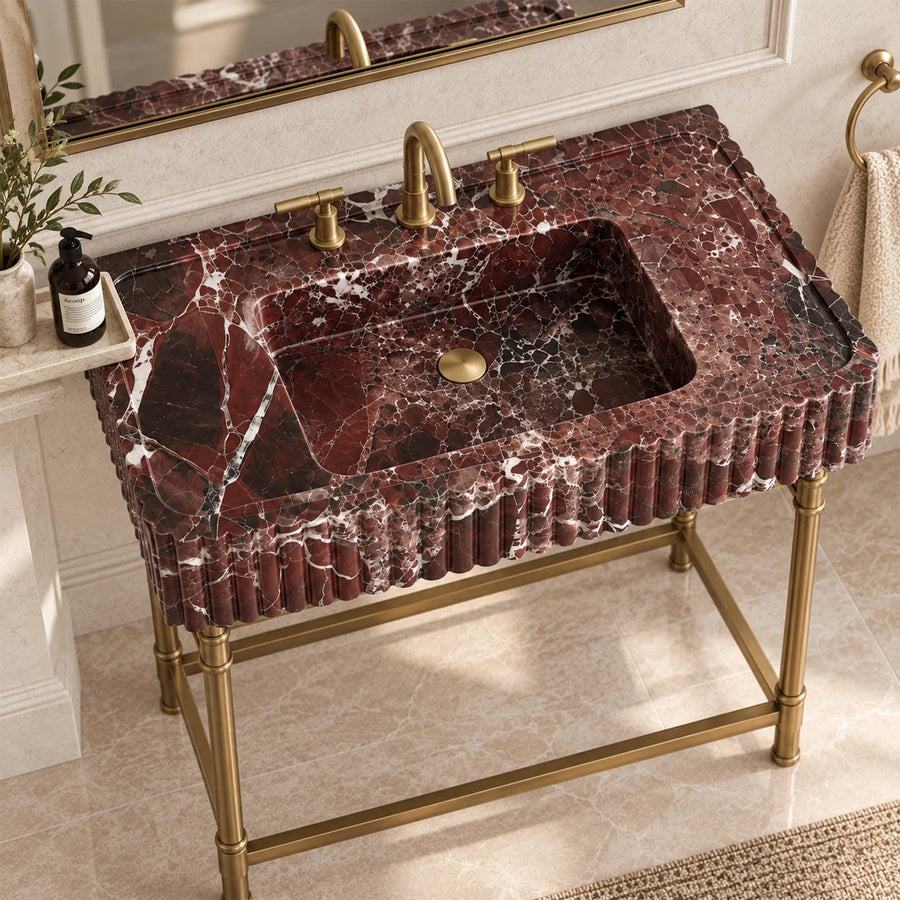 Close-up of natural veining on a Rosso Levanto fluted console sink