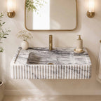 Marble sink with faucet in a bathroom setting