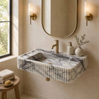 Marble sink with faucet in a bathroom setting
