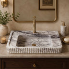 Marble sink with faucet in a bathroom setting