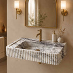 Marble sink with faucet in a bathroom setting
