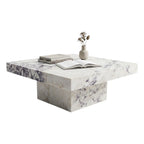 Marble coffee table with books and a vase on a white background