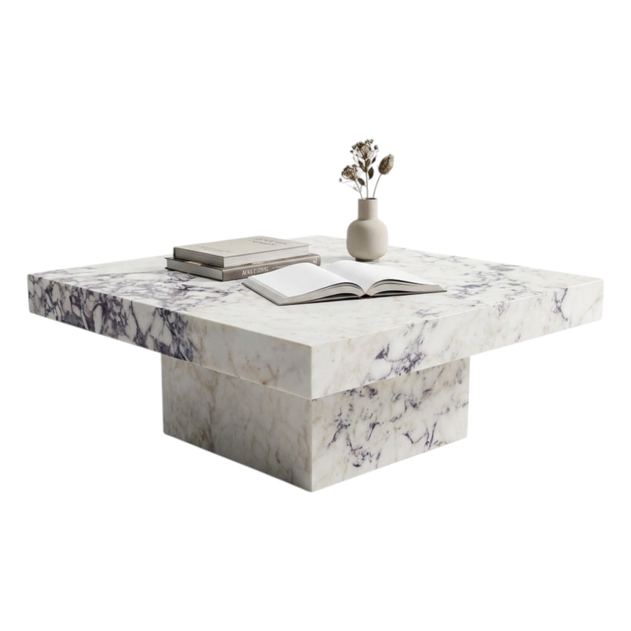 Marble coffee table with books and a vase on a white background