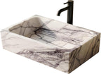 Marble-patterned sink with a black faucet on a white background