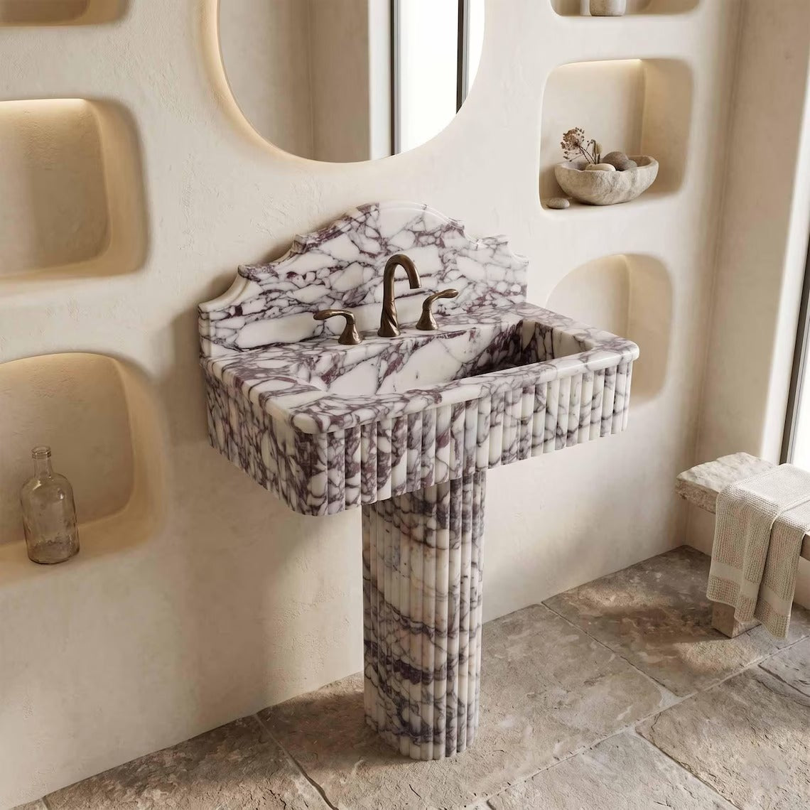 Calacatta viola marble sink with pedestal in a bathroom
