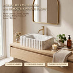 Bathroom vanity with marble sink and wooden countertop, featuring text about Carrara marble.