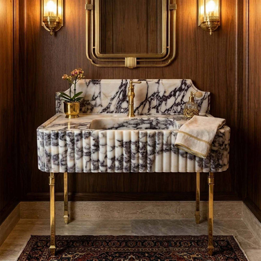 Marble sink with backsplash in dark wood paneled bathroom