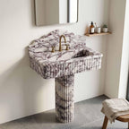 Calacatta viola marble sink with pedestal in a bathroom