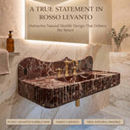 Marble sink with gold faucet in a bathroom setting, featuring Rosso Levanto marble.