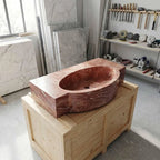 Marble sink on a wooden crate in a workshop setting