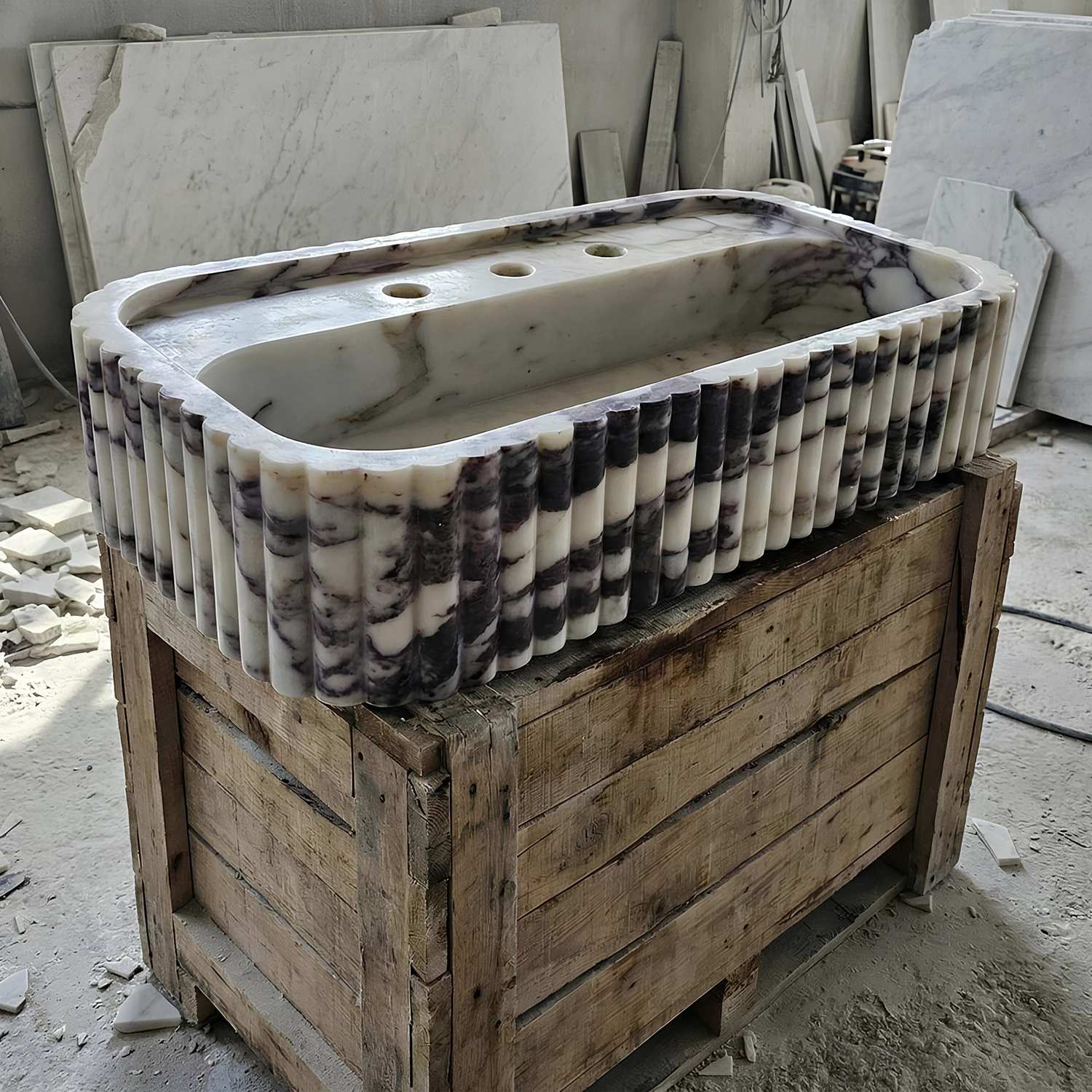 Marble sink on a wooden pallet in a construction site