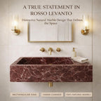 Marble sink with gold fixtures in a bathroom setting, featuring text about Rosso Levanto marble.