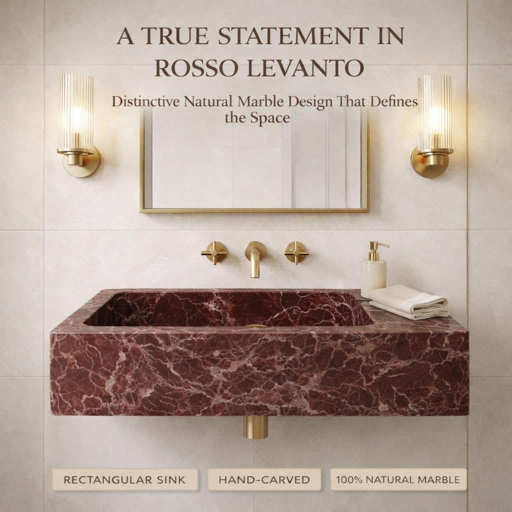 Marble sink with gold fixtures in a bathroom setting, featuring text about Rosso Levanto marble.