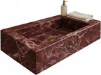 Rosso levanto marble sink with soap dispenser and towel on a white background