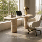 Modern office setup with a marble console table, chair, and laptop.