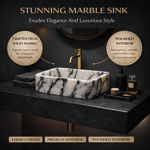 Marble sink with gold faucet on a dark background, highlighting features like solid marble and polished interior.