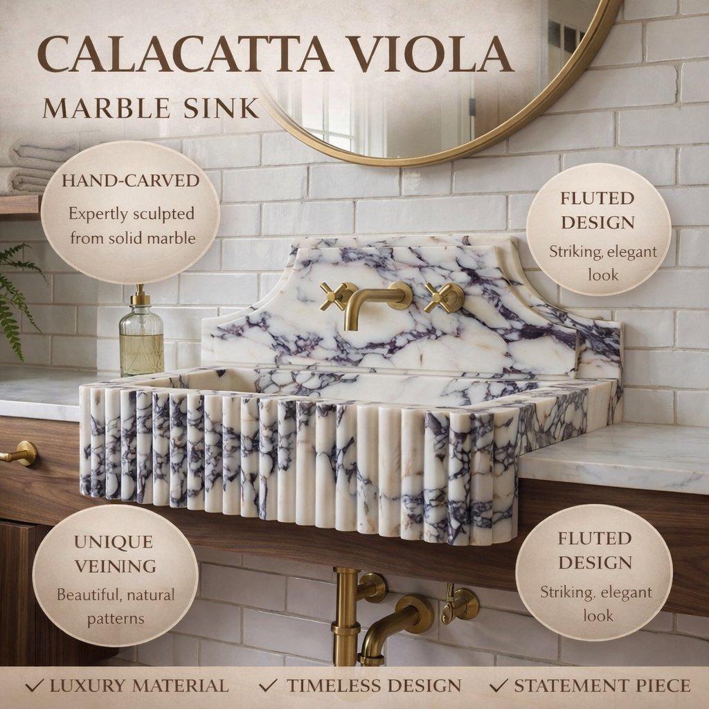 Marble sink with gold faucet in a bathroom setting, featuring text about the Calacatta Viola marble.
